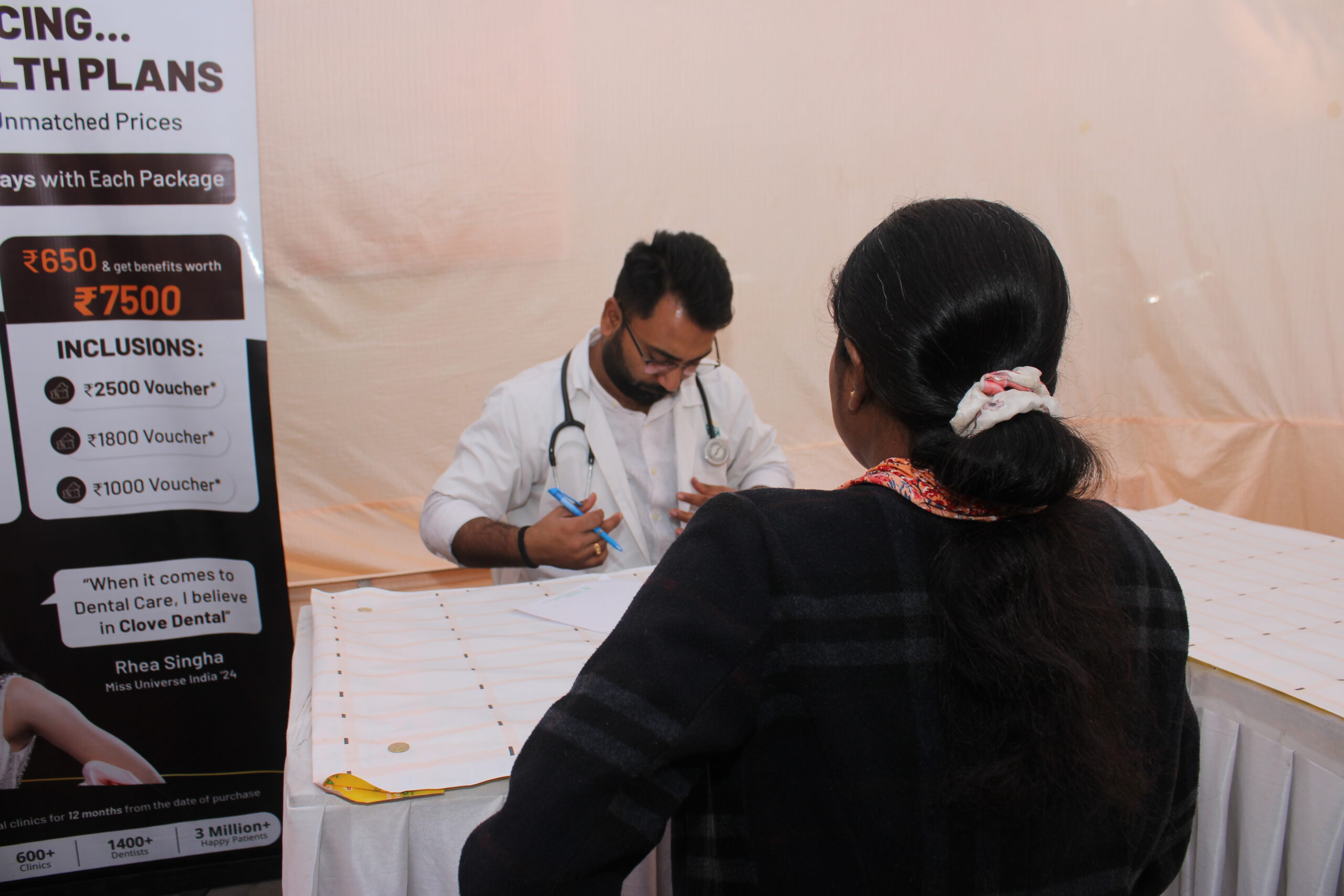Beneficiaries receiving care at a community event