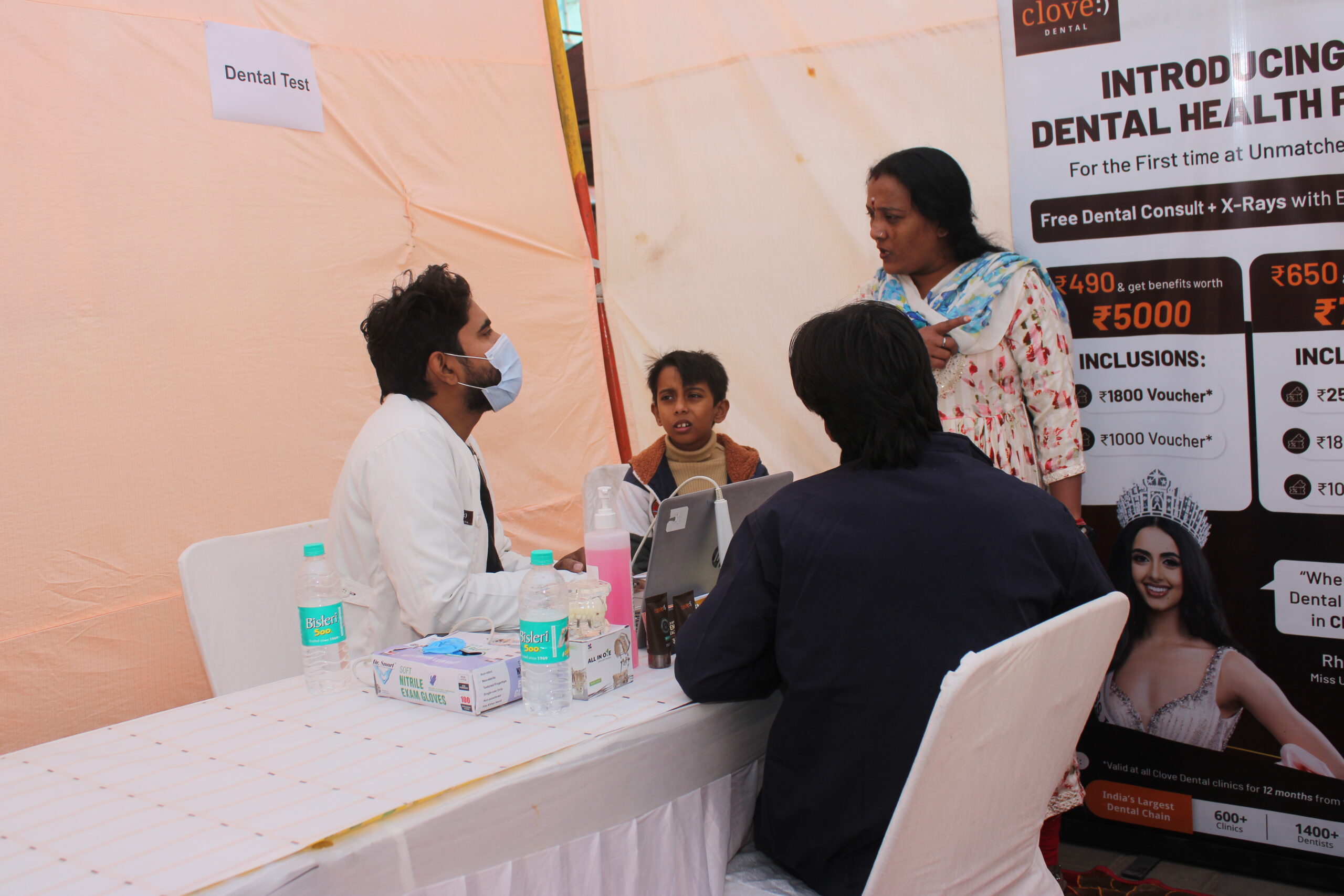 Beneficiaries receiving care at a community event
