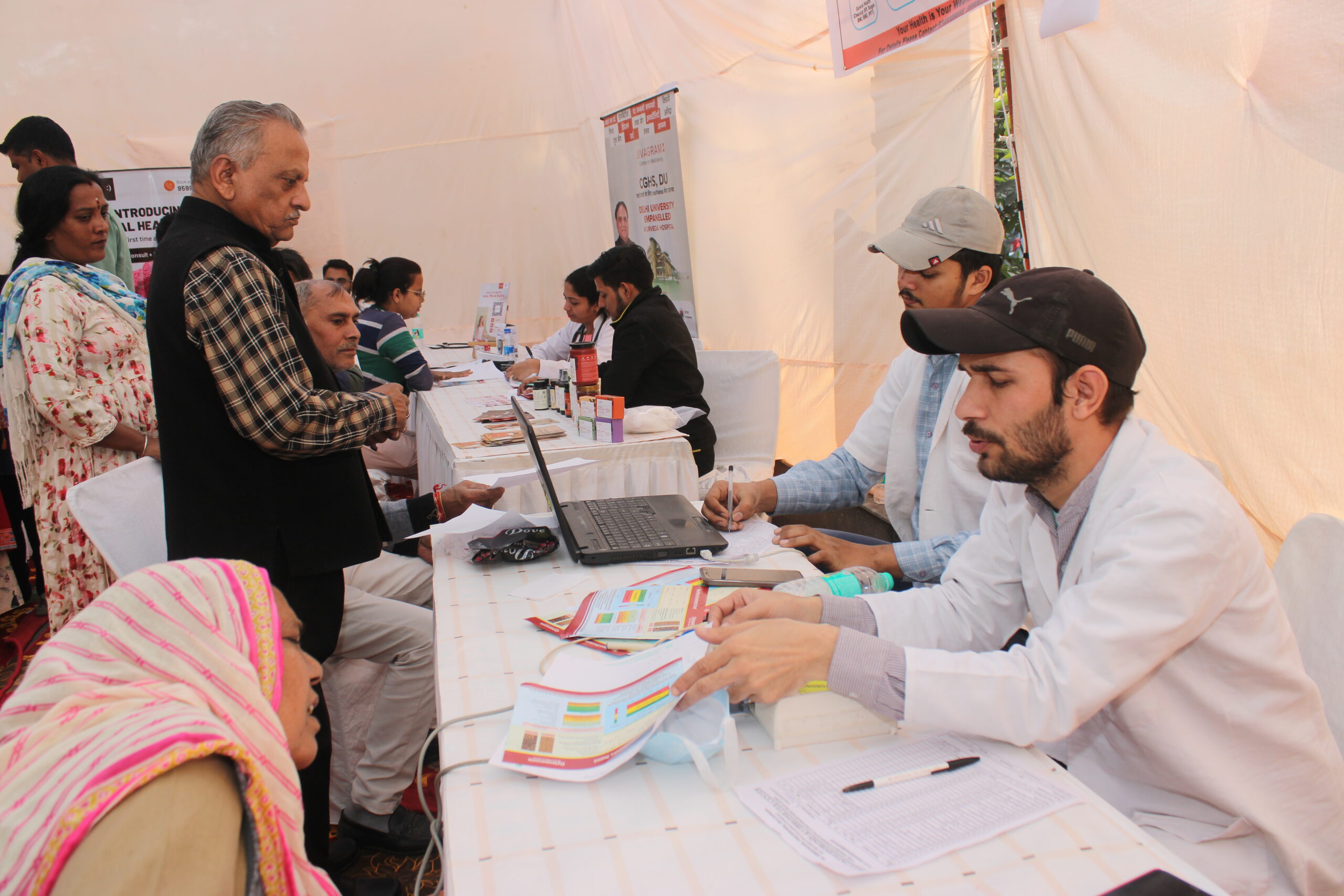 Beneficiaries receiving care at a community event