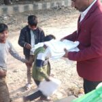 HAFCT Secretary Distributing Old Clothes